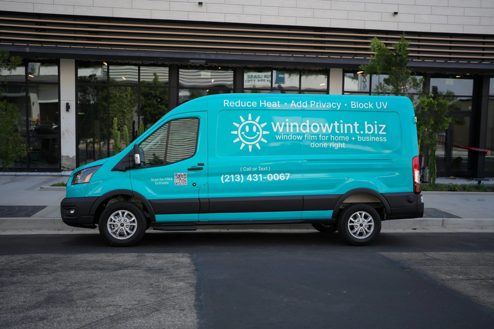WindowTint service van beside the storefront